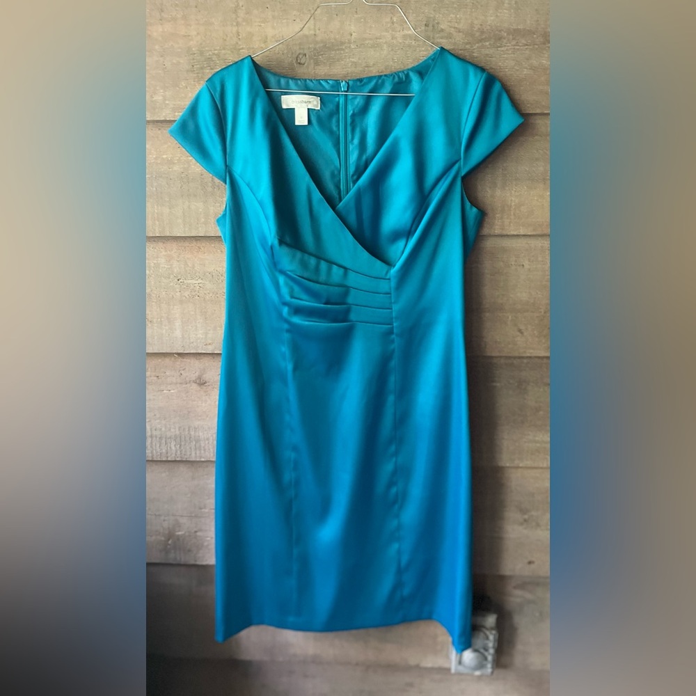 Pretty turquoise dress flattering cut. Stretchy satin.